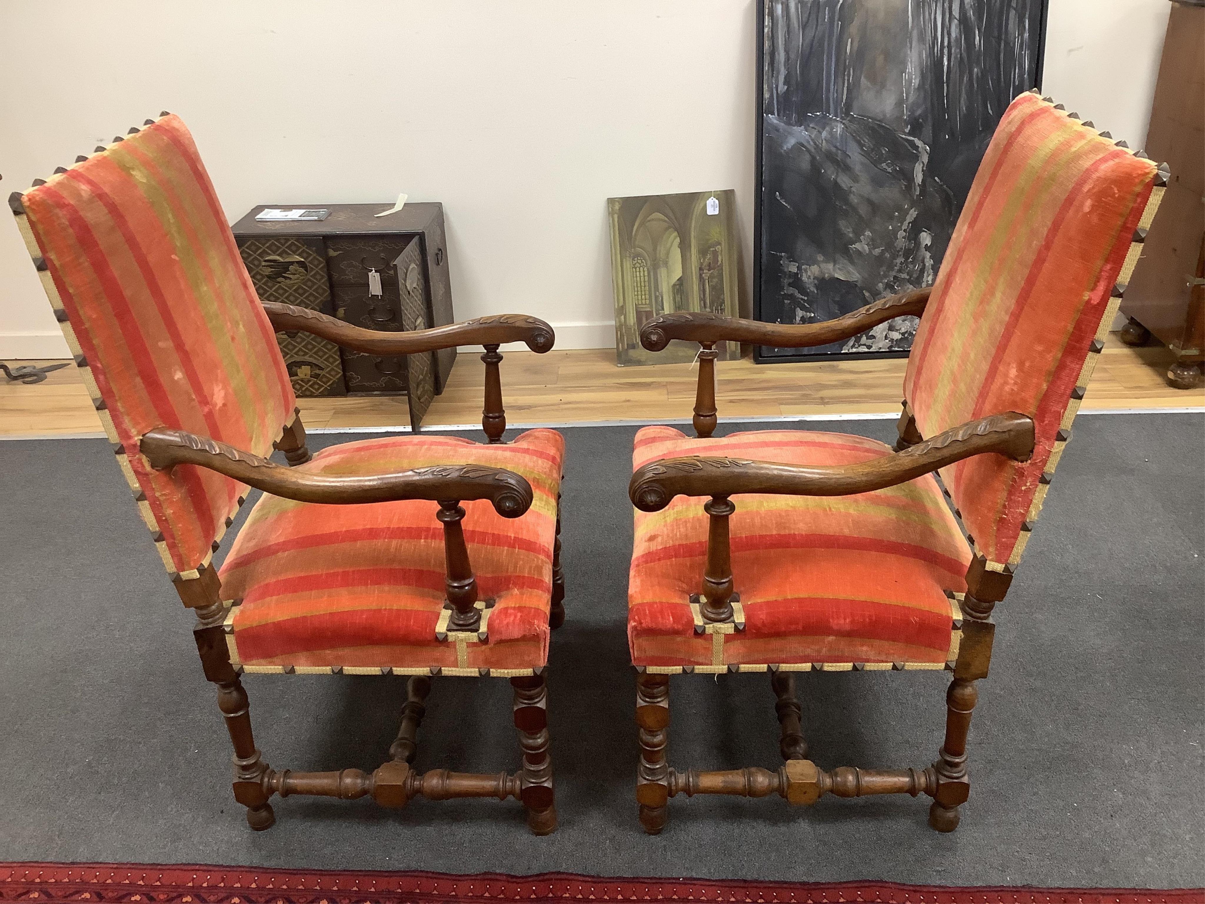 A pair of French walnut elbow chairs, with two matching side chairs, largest 65 x 55cm, height 110cm. Condition - fair